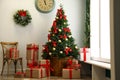 Decorated Christmas tree with gifts. Festive