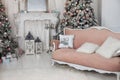 Decorated Christmas tree with gifts, fireplace and sofa. Christmas room interior home. Stylish interior of living room with Christ Royalty Free Stock Photo