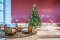 Decorated christmas tree in modern living room or office lobby