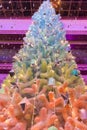 Decorated Christmas tree in pink style. New Year scene.