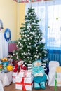 Decorated Christmas tree, snowmen and gifts on New Year's holiday