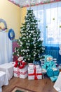 Decorated Christmas tree, snowmen and gifts on New Year's holiday