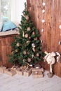 Decorated Christmas tree on wooden background