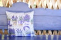 Decorated cushion on the wooden bench