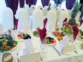 Decorated dining table reception with plates and serviettes