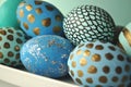 Decorated Easter eggs in a bowl, closeup on pastel background Royalty Free Stock Photo