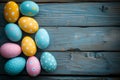 Decorated Easter eggs on dark wooden background, top view. Flat lay composition with empty place for text Royalty Free Stock Photo