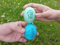 Decorated Easter eggs in hand of man and woman. The custom of tapping egg