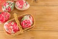 Decorated Easter eggs in a vintage wicker basket Royalty Free Stock Photo