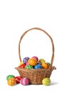 Decorated Easter eggs in wicker basket Royalty Free Stock Photo