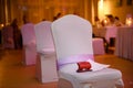 Decorated empty chairs at wedding party. Dancefloor