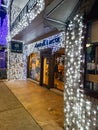 String of lights at the Big, Bright Light Show on main street Rochester Road in Downtown Rochester, Michigan with stores and