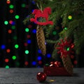 Decorated fir tree with cones and ornaments on the background of bokeh. Christmas and New year celebrations. Royalty Free Stock Photo
