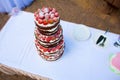 Decorated by fruits colorful naked cake, rustic style for weddings, birthdays and events. Beautiful wedding cake, close up of cake Royalty Free Stock Photo