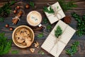 Decorated gift boxes, presents on rustic wooden table. Ideal Christmas morning breakfast. Overhead, flat lay, top view.