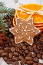 Decorated gingerbread, coffee grains and spices, christmas time Royalty Free Stock Photo