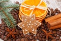 Decorated gingerbread, coffee grains and spices, christmas time Royalty Free Stock Photo