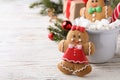 Decorated gingerbread cookies on white wooden table, space for text Royalty Free Stock Photo