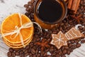 Decorated gingerbread, cup of coffee and grains, spices, christmas time Royalty Free Stock Photo