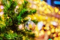 Decorated green christmas tree with silver ball. Orange, yellow and white bokeh light at Festival. Abstract or blurred of light Royalty Free Stock Photo