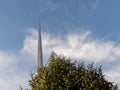 Decorated green fur tree with lights and The Spire monument in the background. Christmas time in Dublin city, the capital of Royalty Free Stock Photo