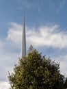 Decorated green fur tree with lights and The Spire monument in the background. Christmas time in Dublin city, the capital of Royalty Free Stock Photo