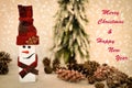 Wooden snowman and pine cones with Merry Christmas and Happy New Year text Royalty Free Stock Photo