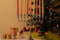 Decorated Hanukkah menorah, Christmas tree, spinning top toys and chocolate coins Royalty Free Stock Photo