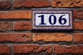 Decorated house number on brick wall in Europe. Bruges (Brugge), Royalty Free Stock Photo