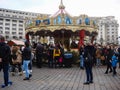 Decorated huge Christmas tree, lights, decorations, hot wine, hot chocolate, presents and people wandering at the Christmas market