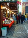 Decorated huge Christmas tree, lights, decorations, hot wine, hot chocolate, presents and people wandering at the Christmas market