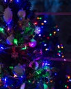 Decorated and illuminated Christmas tree at night, close up background. Royalty Free Stock Photo