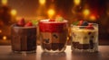 Layered chocolate, vanilla and caramel mousses with strawberries and blackberries and a cozy blur background Royalty Free Stock Photo