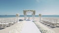 Decorated luxury wedding ceremony place at the beach white sand beautiful sea and sky with White empty chairs and arch decorated Royalty Free Stock Photo