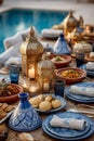 Decorated Maghrebi dining table featuring intricate brass lanterns, vibrant dishes, and elegant tableware, creating a warm and Royalty Free Stock Photo