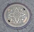 Decorated manhole cover downtown in Budapest, capital city Hungary
