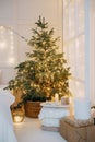 Decorated mirror and live Christmas tree with lights. New year's interior, festive atmosphere, decor, garlands