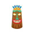 Decorated mystical african mask with toothy smile and small green gemstone in forehead