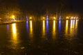Decorated park by the lake at christmas at night Royalty Free Stock Photo