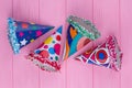 Decorated party hats on color background. Royalty Free Stock Photo