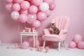 Decorated photo zone for a girl's birthday with pink balloons and a kitten