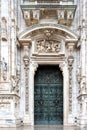 Milan Cathedral, famous bronze door and marmor decoration on facade, Duomo Milano, Italy