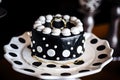 decorated ring cake with black and white polka dots