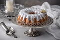decorated ring cake sitting on silver platter, ready to be served