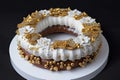 decorated ring cake with sprinkle of gold and silver dragees