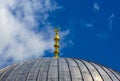 Decorated roof of an ancient mosque against a blue sky with clouds Royalty Free Stock Photo