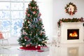 Decorated room with Christmas tree and fireplace Royalty Free Stock Photo