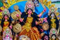 Decorated sculpture of goddess Durga idol on lion with ten arms at pandal and temple in colored light. Durga Puja is big cultural