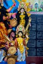 Decorated sculpture of goddess Durga idol on lion with ten arms at pandal and temple in colored light. Durga Puja is big cultural