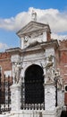 Decorated with statues, the main entrance (Porta Magna) to the Venetian Arsenal and Naval Museum Royalty Free Stock Photo